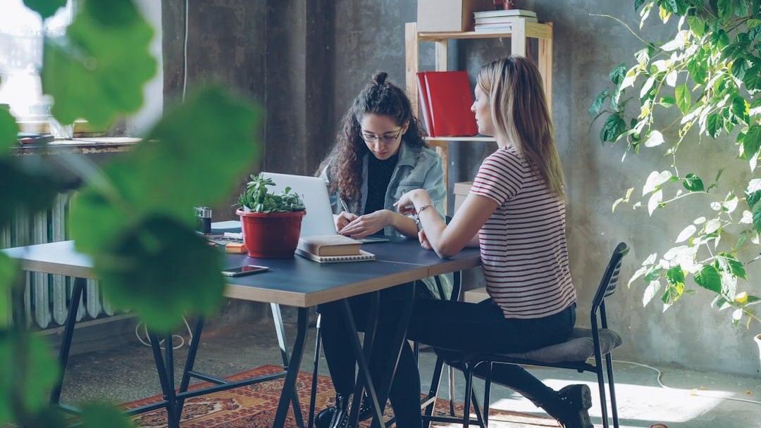 Two professionals practicing an interview session in a modern office