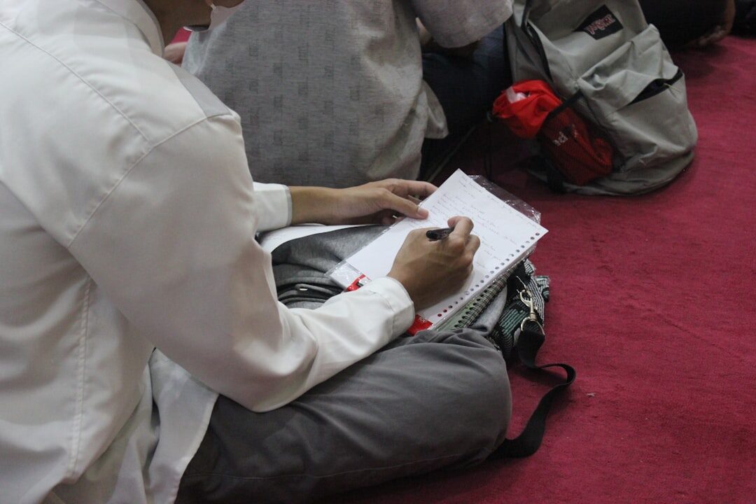 Journalist taking notes in a masterclass session