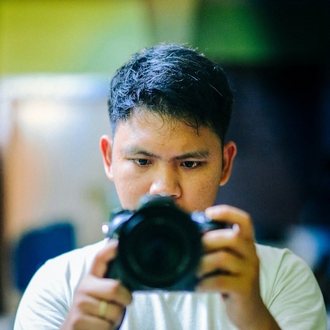 Young professional male media trainer with approachable expression